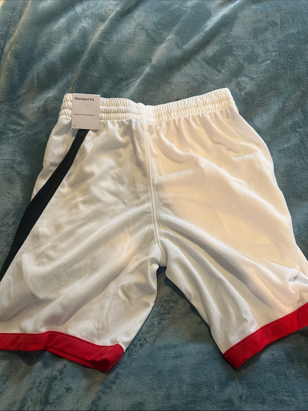 Nike White Kids Athletic Shorts with Red Trim and Black Accent